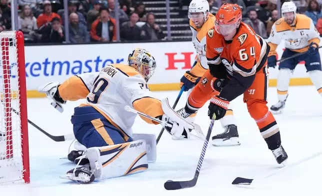 Anaheim Ducks' center Mikael Granlund (64) fails to score against Nashville Predators' goaltender Justus Annunen (29) during the first period of an NHL hockey game Tuesday, April 7, 2026, in Anaheim, Calif.. (AP Photo/Scott Strazzante)