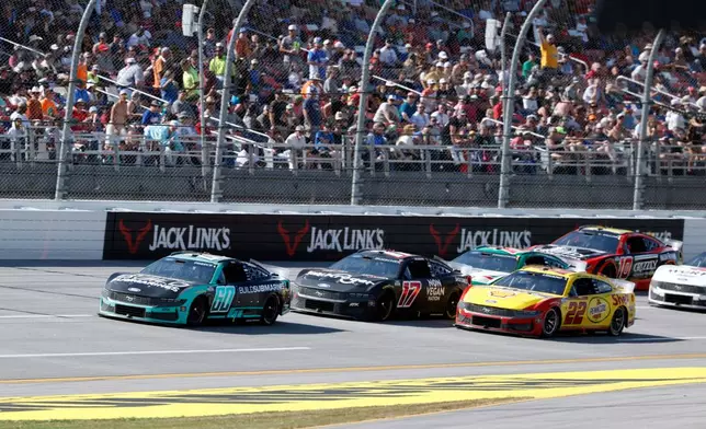 Ryan Preece (60) wins the first stage of a NASCAR Cup Series auto race, Sunday, April 26, 2026, in Talladega, Ala. (AP Photo/Butch Dill)