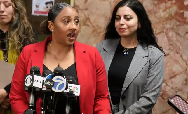 Public defenders Diamond Ward, foreground left, and Nuha Abusamra, right, representing, Daniel Moreno-Gama, speak to reporters outside of a courtroom on Tuesday, April 14, 2026, in San Francisco. (AP Photo/Jeff Chiu)