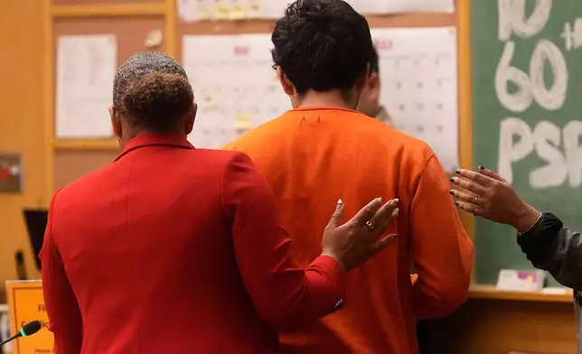 Daniel Moreno-Gama, right, leaves court with public defender Diamond Ward on Tuesday, April 14, 2026, in San Francisco. (AP Photo/Jeff Chiu, Pool)