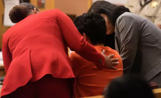 Daniel Moreno-Gama, middle, appears in court with public defenders Diamond Ward, left, and Nuha Abusamra on Tuesday, April 14, 2026, in San Francisco. (AP Photo/Jeff Chiu, Pool)