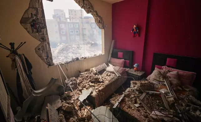 A bedroom is damaged in a building struck in an Israeli airstrike in the southern port city of Tyre, Lebanon, Saturday, April 4, 2026. (AP Photo/Mohammed Zaatari)