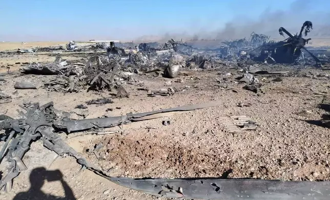 In this image provided by Sepahnews, the Iranian Revolutionary Guard's official website, wreckage is shown at what Iran's state TV claimed was the site of a downed American transport plane and two helicopters involved in a rescue operation, in Isfahan province, Iran, April, 2026. (Sepahnews via AP)