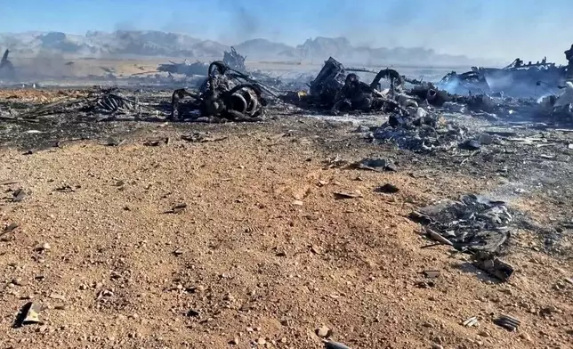 In this image provided by Sepahnews, the Iranian Revolutionary Guard's official website, wreckage is shown at what Iran's state TV claimed was the site of a downed American transport plane and two helicopters involved in a rescue operation, in Isfahan province, Iran, April, 2026. (Sepahnews via AP)