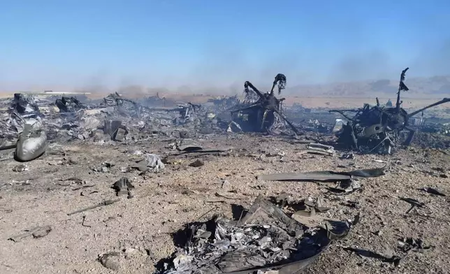 In this image provided by Sepahnews, the Iranian Revolutionary Guard's official website, wreckage is shown at what Iran's state TV claimed was the site of a downed American transport plane and two helicopters involved in a rescue operation, in Isfahan province, Iran, April, 2026. (Sepahnews via AP)