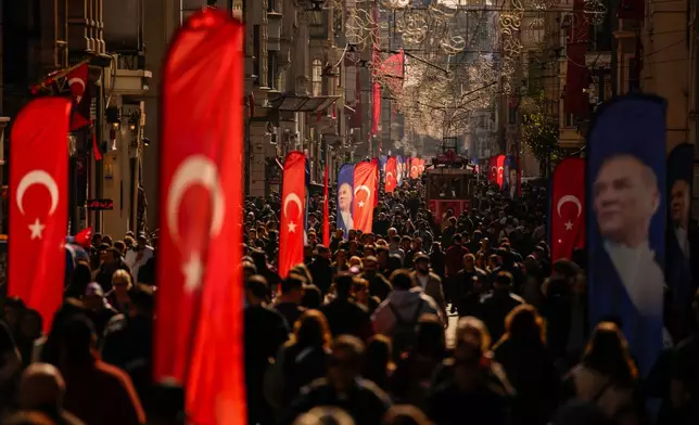 People crowd Istiklal main street, in Istanbul, Turkey, Thursday, April 23, 2026, during National Sovereignty and Children's Day. (AP Photo/Emrah Gurel)