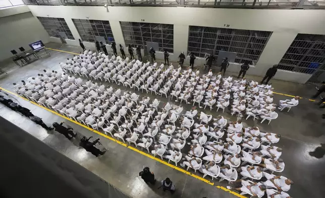 Alleged gang members take part in a mass trial at the Terrorism Confinement Center (CECOT) in Tecoluca, El Salvador, Thursday, April 23, 2026. (AP Photo/Salvador Melendez)