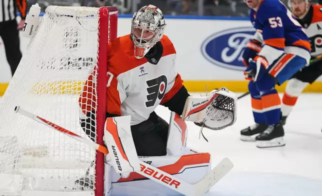 Philadelphia Flyers goaltender Dan Vladar (80) protects the net during the second period of an NHL hockey game against the New York Islanders Friday, April 3, 2026, in Elmont, N.Y. (AP Photo/Frank Franklin II)