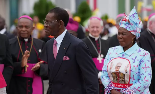 Equatorial Guinea's President Teodoro Obiang Nguema Mbasogo, front, attends a welcome ceremony for Pope Leo XIV at Malabo International Airport in Malabo, Equatorial Guinea, Tuesday, April 21, 2026, on the ninth day of Pope Leo's 11-day pastoral visit to Africa. (AP Photo/Misper Apawu)