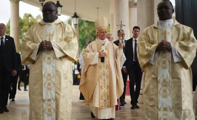 Pope Leo XIV arrives to celebrate the Holy mass at the Basilica of the Immaculate Conception of Mongomo, Equatorial Guinea, Wednesday, April 22, 2026, on the tenth day of his 11-day pastoral visit to Africa. (AP Photo/Andrew Medichini)