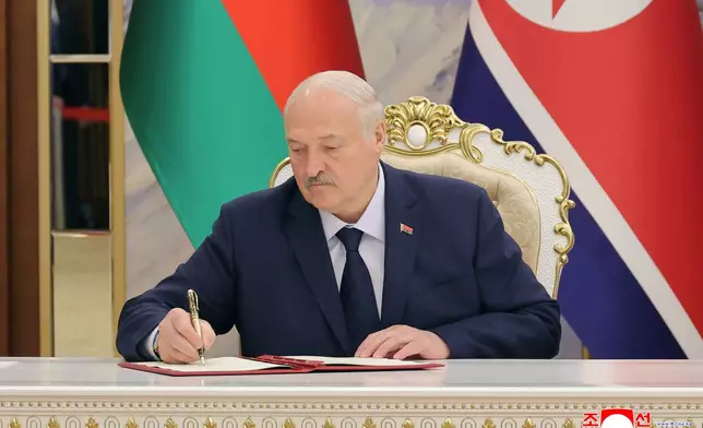 In this photo provided by the North Korean government, Belarus’ President Alexander Lukashenko signs a document in Pyongyang, North Korea Thursday, March 26, 2026. Independent journalists were not given access to cover the event depicted in this image distributed by the North Korean government. The content of this image is as provided and cannot be independently verified. Korean language watermark on image as provided by source reads: "KCNA" which is the abbreviation for Korean Central News Agency. (Korean Central News Agency/Korea News Service via AP)