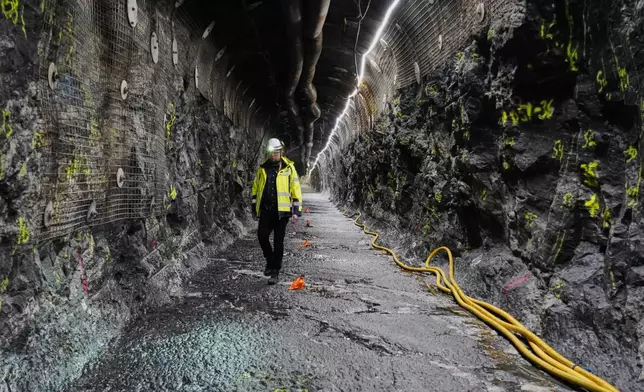 Geologist Tuomas Pere walks down a disposal tunnel inside the Posiva Onkalo nuclear waste repository on the island of Olkiluoto, Finland, Tuesday, Feb. 24, 2026. (AP Photo/James Brooks)