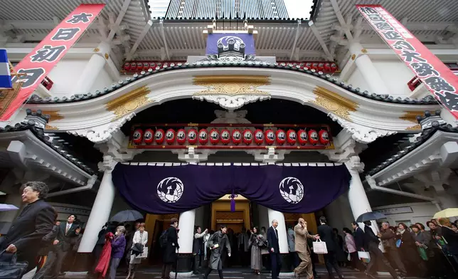 FILE - People walk out from newly-refurbished Kabukiza Theatre on its opening day in Tokyo Tuesday, April 2, 2013, following a three-year renovation work. (AP Photo/Shizuo Kambayashi, File)