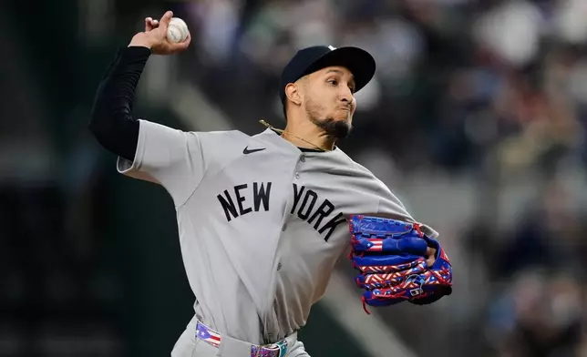 New York Yankees starting pitcher Elmer Rodriguez makes his major league debut as he throws to the Texas Rangers in the first inning of a baseball game Wednesday, April 29, 2026, in Arlington, Texas. (AP Photo/Tony Gutierrez)