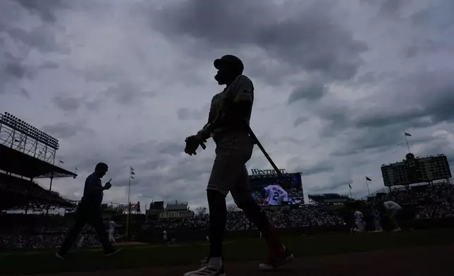 Pittsburgh Pirates' Oneil Cruz walks to batting during the first inning of a baseball game against the Chicago Cubs, in Chicago, Sunday, April 12, 2026. (AP Photo/Nam Y. Huh)