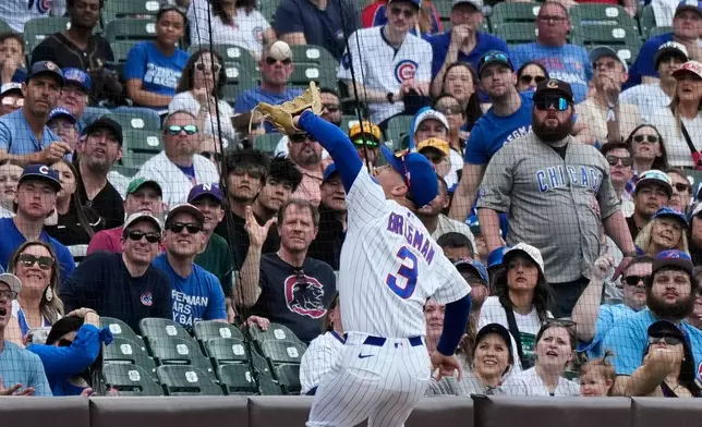 Chicago Cubs third baseman Alex Bregman catches a fly ball hit by Pittsburgh Pirates' Bryan Reynolds in foul territory during the first inning of a baseball game in Chicago, Sunday, April 12, 2026. (AP Photo/Nam Y. Huh)