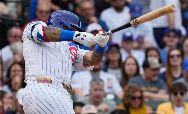 Chicago Cubs' Moisés Ballesteros hits a single during the fifth inning of a baseball game against the Pittsburgh Pirates in Chicago, Sunday, April 12, 2026. (AP Photo/Nam Y. Huh)