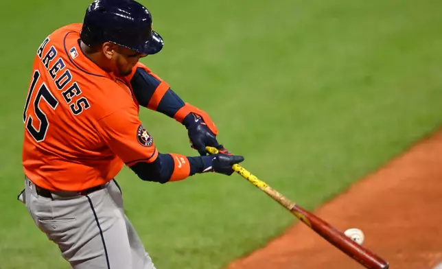 Houston Astros' Isaac Paredes hits a solo home run in the ninth inning of a baseball game against the Cleveland Guardians in Cleveland, Monday, April 20, 2026. (AP Photo/David Richard)