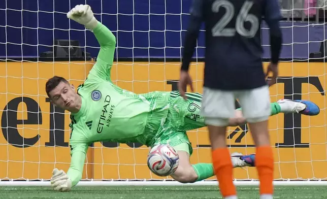 New York City FC goalkeeper Matt Freese (49) stops Vancouver Whitecaps' Brian White (not shown) during the first half of an MLS soccer match in Vancouver, British Columbia, Saturday, April 11, 2026. (Darryl Dyck/The Canadian Press via AP)