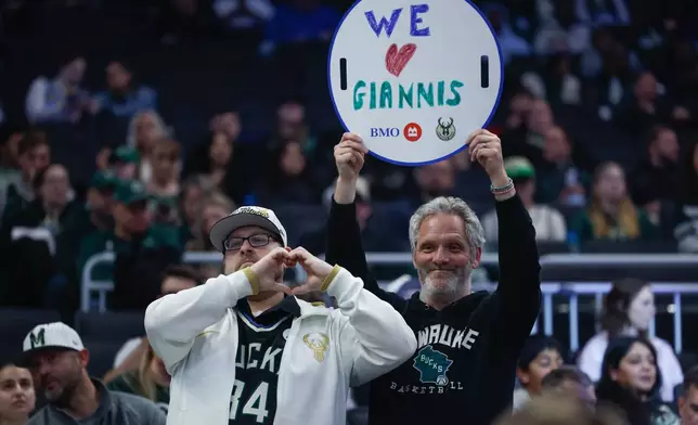 Milwaukee Bucks fans show their appreciation to Giannis Antetokounmpo during the first half of an NBA basketball game against the Brooklyn Nets, Friday, April 10, 2026, in Milwaukee. (AP Photo/Jeffrey Phelps)