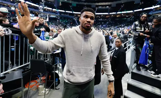 Milwaukee Bucks forward Giannis Antetokounmpo, center, walks off the court after an NBA basketball game against the Brooklyn Nets, Friday, April 10, 2026, in Milwaukee. (AP Photo/Jeffrey Phelps)