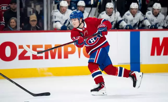 Montreal Canadiens' Cole Caufield shoots during first-period NHL hockey game action against the Tampa Bay Lightning in Montreal, Thursday, April 9, 2026. (Christopher Katsarov/The Canadian Press via AP)