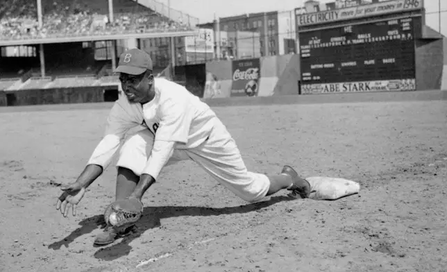 FILE - Jackie Robinson, Brooklyn Dodgers' first baseman, is shown at Ebbets Field, April 11, 1947. (AP Photo/File)