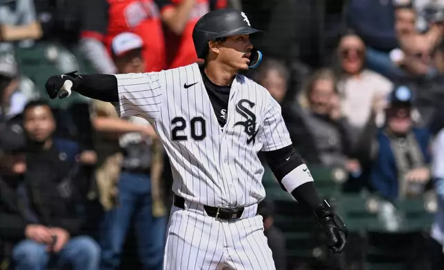 Chicago White Sox's Miguel Vargas (20) celebrates at third base after hitting an RBI triple during the first inning of a baseball game against the Toronto Blue Jays in Chicago, Sunday, April 5, 2026. (AP Photo/Paul Beaty)
