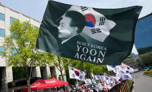 Supporters of former South Korean President Yoon Suk Yeol stage a rally outside of the Seoul High Court in Seoul, South Korea, Wednesday, April 29, 2026. (AP Photo/Ahn Young-joon)