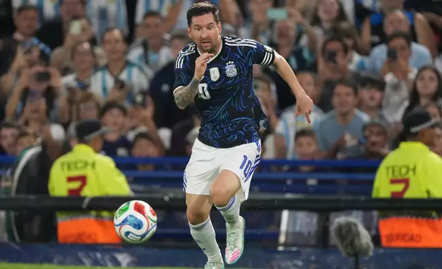 FILE - Argentina's Lionel Messi dribbles during a friendly soccer match against Zambia in Buenos Aires, Argentina, Tuesday, March 31, 2026. (AP Photo/Gustavo Garello, File)