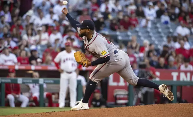 Atlanta Braves pitcher Reynaldo López (40) delivers during the first inning of a baseball game against the Los Angeles Angels, Tuesday, April 7, 2026, in Anaheim, Calif. (AP Photo/Ethan Swope)