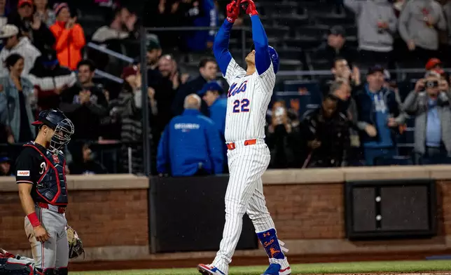 New York Mets' Juan Soto (22) celebrates scoring a two-run home run during the fourth inning of a baseball game against the Washington Nationals, Tuesday, April 28, 2026, in New York. (AP Photo/Angelina Katsanis)