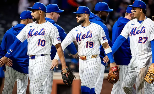 New York Mets celebrate their 8-0 win against the Washington Nationals after a baseball game, Tuesday, April 28, 2026, in New York. (AP Photo/Angelina Katsanis)