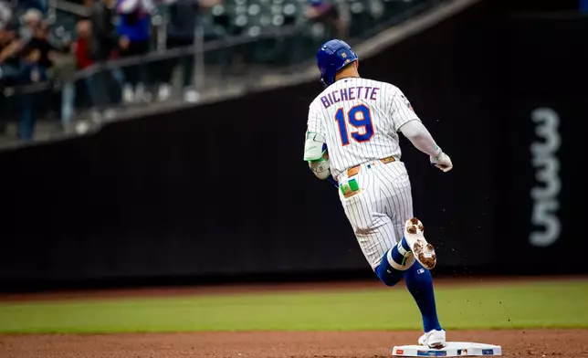 New York Mets' Bo Bichette (19) runs the bases during a home run in the first inning of a baseball game against the Washington Nationals, Tuesday, April 28, 2026, in New York. (AP Photo/Angelina Katsanis)
