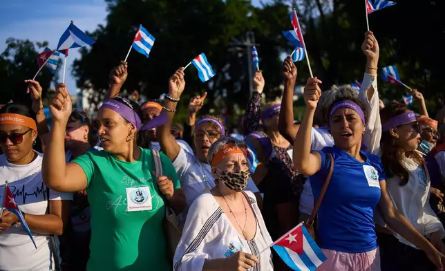 Women attend a rally calling for the end of the U.S. blockade against the island nation in Havana, Cuba, Tuesday, April 7, 2026. (AP Photo/Ramon Espinosa)