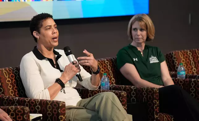 Former Basketball player Cheryl Miller speaks beside Julie Church, Delta State women's basketball assistant coach, during an event Thursday, April 2, 2026, in Phoenix. (AP Photo/John Locher)