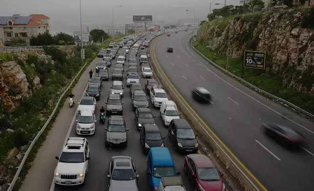 Displaced residents drive back to their villages following a ceasefire between Israel and Hezbollah, in Jiyeh, near Saida, southern Lebanon, Friday, April 17, 2026. (AP Photo/Hassan Ammar)