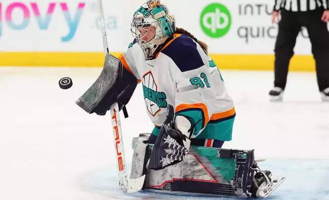 New York Sirens goaltender Kayle Osborne (82) makes a save against the Toronto Sceptres during the second period of an PWHL hockey game in Toronto on Tuesday, April 21, 2026. (Frank Gunn/The Canadian Press via AP)