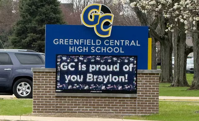 A digital sign outside Greenfield Central High School in Greenfield, Ind., congratulates the UConn men's college basketball team and Greenfield graduate Braylon Mullins, Monday, March 30, 2026, following the Husky's Elite Eight win over Duke in the NCAA Tournament. (AP Photo/Mike Marot)