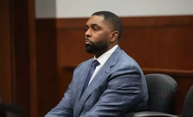 Former Michigan football coach Sherrone Moore appears in court, Tuesday, April 14, 2026, in Ann Arbor, Mich. (AP Photo/Paul Sancya)