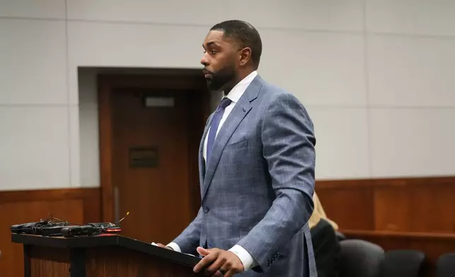 Former Michigan football coach Sherrone Moore addresses the court Tuesday, April 14, 2026, in Ann Arbor, Mich. (AP Photo/Paul Sancya)