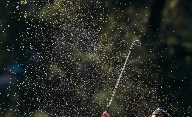 Brian Harman hits from the bunker on the third hole during the second round of the Masters golf tournament at the Augusta National Golf Club, Friday, April 10, 2026, in Augusta, Ga. (AP Photo/Ashley Landis)