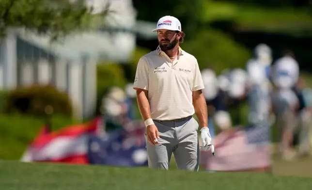 Cameron Young hits from the fairway on the first hole during the final round of the Masters golf tournament at the Augusta National Golf Club, Sunday, April 12, 2026, in Augusta, Ga. (AP Photo/Matt Slocum)