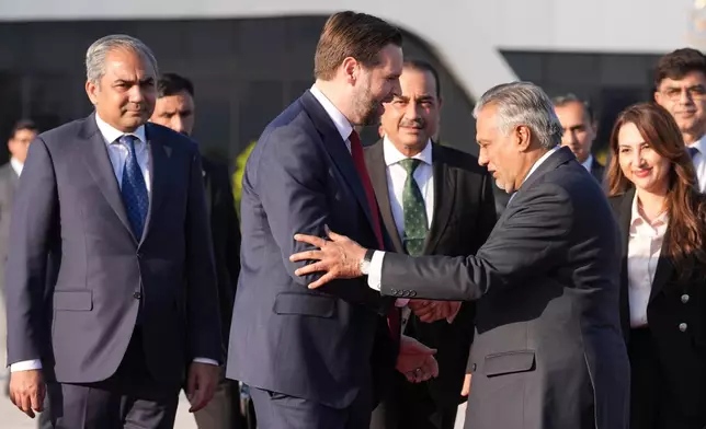 Vice President JD Vance, second left, shakes hands with Pakistani Deputy Prime Minister and Foreign Minister Mohammad Ishaq Dar, as Pakistan's Interior Minister Mohsin Naqvi, left, Pakistan's Chief of Defence Forces Chief of Army Staff Field Marshall Asim Munir, third left, and Charge d'Affaires of the U.S. Embassy in Islamabad Natalie A. Baker, right, look on, as he prepares to board Air Force Two after attending talks on Iran in Islamabad, Pakistan, Sunday, April 12, 2026. (AP Photo/Jacquelyn Martin, Pool)