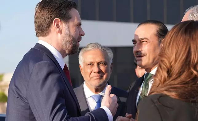 Vice President JD Vance, left, talks to Pakistan's Chief of Defence Forces and Chief of Army Staff Field Marshall Asim Munir, right, and Pakistani Deputy Prime Minister and Foreign Minister Mohammad Ishaq Dar, center, before boarding Air Force Two after attending talks on Iran in Islamabad, Pakistan, Sunday, April 12, 2026. (AP Photo/Jacquelyn Martin, Pool)