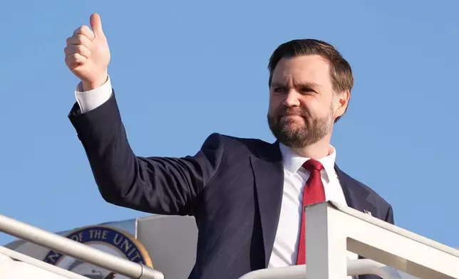 Vice President JD Vance gives a thumb up sign as he boards Air Force Two after attending talks on Iran in Islamabad, Pakistan, Sunday, April 12, 2026, . (AP Photo/Jacquelyn Martin, Pool)