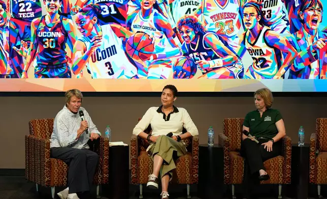Former Basketball player Ann Meyers Drysdale, left, speaks beside former basketball player Cheryl Miller, center, and Julie Church, Delta State women's basketball assistant coach, during an event Thursday, April 2, 2026, in Phoenix. (AP Photo/John Locher)