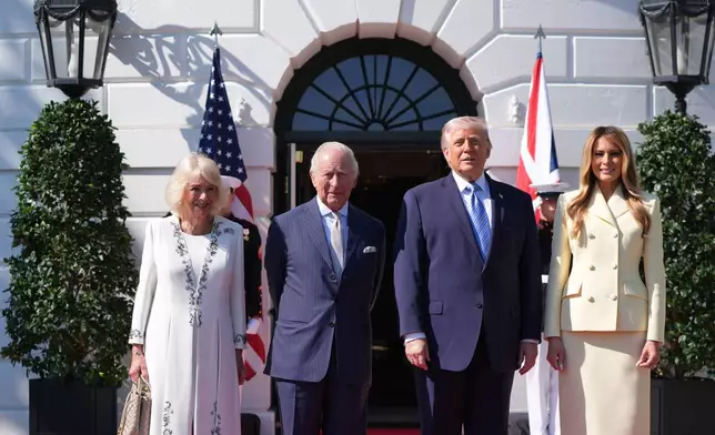 President Donald Trump and first lady Melania Trump greet King Charles III and Queen Camilla as they arrive at the White House, Monday, April 27, 2026, in Washington. (AP Photo/Alex Brandon).