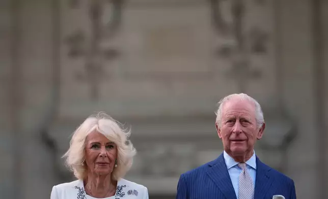 Britain's King Charles III and Queen Camilla pose for a photo outside of the British Embassy, Monday, April 27, 2026, in Washington. (AP Photo/Julia Demaree Nikhinson, Pool)
