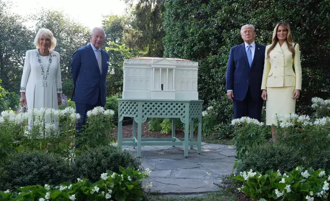 President Donald Trump and first lady Melania Trump stand for a photo with Britain's King Charles III and Queen Camilla at the White House bee hive on the South Lawn of the White House, Monday, April 27, 2026, in Washington. (AP Photo/Alex Brandon, Pool)
